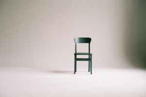green wooden chair on white surface
